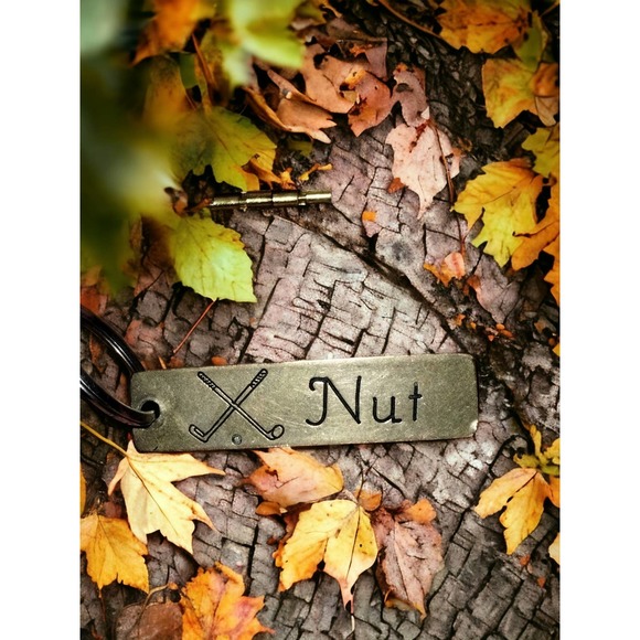 Funny little gold and black keychain that says NUT - Picture 1 of 1